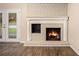 Living room fireplace with brick surround and wood mantel at 3661 Collins Dr, Douglasville, GA 30135