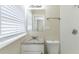 Clean bathroom with granite countertop, white vanity, and shower at 6677 Songwood Dr, Austell, GA 30168