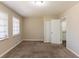 Bright bedroom with neutral walls, carpet, and ample closet space at 6677 Songwood Dr, Austell, GA 30168