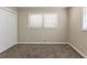 Bedroom with double door closet and neutral carpeting at 6677 Songwood Dr, Austell, GA 30168