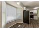 Dining area with bay window and view of kitchen at 6677 Songwood Dr, Austell, GA 30168
