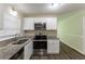 Updated kitchen, white cabinets, granite counters at 6677 Songwood Dr, Austell, GA 30168