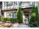 Townhouse front entrance with landscaping and gray door at 2846 Haven Ln, Decatur, GA 30030