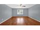Spacious bedroom with hardwood floors and gray walls at 4481 Nantucket Sw Dr, Lilburn, GA 30047
