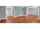 Spacious living room with hardwood floors and views to dining room and staircase at 4481 Nantucket Sw Dr, Lilburn, GA 30047
