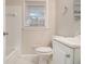 Clean bathroom with white tile, bathtub, and vanity at 796 Vanderbilt Nw Ct, Atlanta, GA 30318