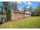 Side view of brick ranch house with a large yard at 796 Vanderbilt Nw Ct, Atlanta, GA 30318