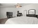 Bright bedroom with large bed, TV, and home office at 2133 Hasel St, Lawrenceville, GA 30044