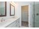 Elegant bathroom with double vanity, large mirror, and walk-in shower at 358 Olmstead Way # 25, Alpharetta, GA 30022