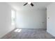 Spacious bedroom with grey carpet and ceiling fan at 358 Olmstead Way # 25, Alpharetta, GA 30022