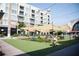 Community green space with tables, chairs, and shade structures at 358 Olmstead Way # 25, Alpharetta, GA 30022