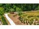 Walking path winds through lush landscaping, pond, and nature at 358 Olmstead Way # 25, Alpharetta, GA 30022