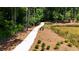 Paved path offering a peaceful walk through wooded area at 358 Olmstead Way # 25, Alpharetta, GA 30022