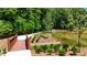 Wooden footbridge over a serene pond in the community at 358 Olmstead Way # 25, Alpharetta, GA 30022