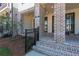Brick front porch with a black metal railing at 358 Olmstead Way # 25, Alpharetta, GA 30022