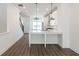 Modern kitchen with white cabinets, quartz countertops, and stainless steel appliances at 358 Olmstead Way # 25, Alpharetta, GA 30022