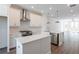 Modern kitchen with island, white cabinets and stainless steel appliances at 358 Olmstead Way # 25, Alpharetta, GA 30022