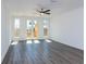 Living room with hardwood floors and doors leading to a deck at 358 Olmstead Way # 25, Alpharetta, GA 30022