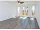 Spacious living room with hardwood floors and access to a deck at 358 Olmstead Way # 25, Alpharetta, GA 30022