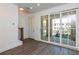 Bright living room with hardwood floors and patio access at 358 Olmstead Way # 25, Alpharetta, GA 30022