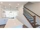 Elegant staircase with dark wood railings and white walls at 358 Olmstead Way # 25, Alpharetta, GA 30022