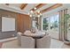 Elegant dining room with wood beams, chandelier, and round table at 2810 Herrington Dr, Cumming, GA 30041