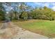 Long driveway leading to a charming house on a large lot at 2855 Highway 20 Se, Conyers, GA 30013