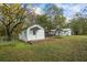 View of the house exterior showcasing the backyard and additional structure at 2855 Highway 20 Se, Conyers, GA 30013