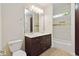 Bathroom with double vanity, tiled shower/tub combo, and modern fixtures at 950 Mill Creek Run, Suwanee, GA 30024