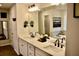 Elegant bathroom with double vanity, soaking tub, and modern fixtures at 100 Leveret Rd, Locust Grove, GA 30248