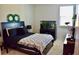 Cozy bedroom with a queen-size bed and a fish tank at 100 Leveret Rd, Locust Grove, GA 30248