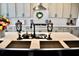 Spacious kitchen island with a farmhouse sink and black accents at 100 Leveret Rd, Locust Grove, GA 30248