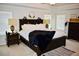 Spacious main bedroom with a king-size bed and nightstands at 100 Leveret Rd, Locust Grove, GA 30248