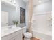 Clean bathroom with white vanity, tub, and shower at 4175 Viola Pl, Atlanta, GA 30349