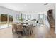 Open dining area with a light wood table and access to the backyard at 4175 Viola Pl, Atlanta, GA 30349