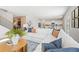 Open concept living room with sectional sofa and view into the dining and kitchen areas at 4175 Viola Pl, Atlanta, GA 30349