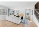 Spacious living room with hardwood floors, large windows, and a comfortable sectional sofa at 4175 Viola Pl, Atlanta, GA 30349