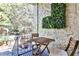 Small balcony with bistro set and green wall at 70 Sheridan Ne Dr # 10, Atlanta, GA 30305