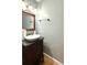 Small bathroom with dark vanity, vessel sink, and gray walls at 3920 Genoa Ct, Duluth, GA 30096