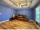 Main bedroom with hardwood floors, tray ceiling and large window at 3920 Genoa Ct, Duluth, GA 30096