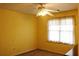 Small bedroom with ceiling fan and window at 4761 Habersham Way, Conyers, GA 30094
