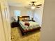 Cozy bedroom with a queen bed and ceiling fan at 4761 Habersham Way, Conyers, GA 30094