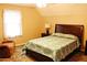 Bedroom with queen bed, ceiling fan, and a recliner at 4761 Habersham Way, Conyers, GA 30094