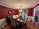 Formal dining room featuring hardwood floors and a dark wood table at 4761 Habersham Way, Conyers, GA 30094