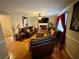 Living room featuring hardwood floors, fireplace and ample seating at 4761 Habersham Way, Conyers, GA 30094