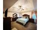 Spacious main bedroom with a king-size bed, large dresser, and ceiling fan at 4761 Habersham Way, Conyers, GA 30094