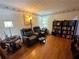 Cozy reading room with hardwood floors, two recliners, and built-in bookcase at 4761 Habersham Way, Conyers, GA 30094
