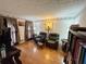 Relaxing reading room with hardwood floors, two recliners and a bookcase at 4761 Habersham Way, Conyers, GA 30094