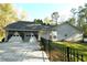 Two-car garage with driveway and black fence at 343 Cannongate Rd, Sharpsburg, GA 30277