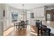 Kitchen breakfast area with hardwood floors and view at 1350 Country Lake Sw Dr, Lilburn, GA 30047